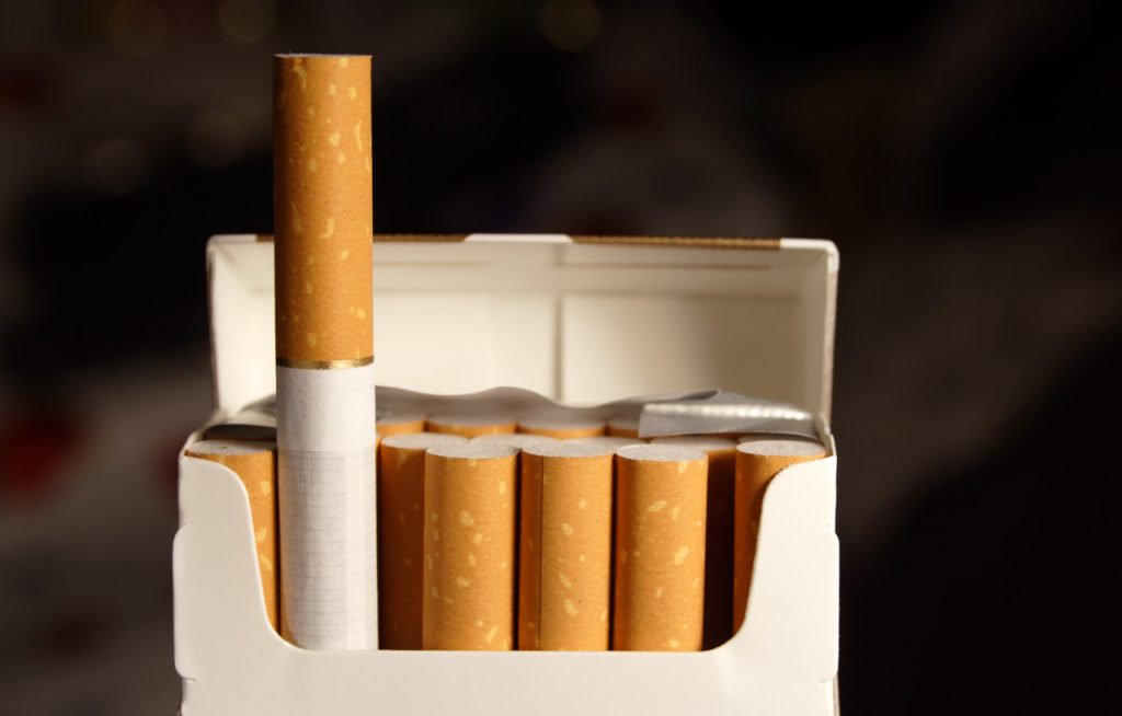 Open pack of filter cigarettes from a cigarette shop Houston showing tobacco products and premium smoking accessories.