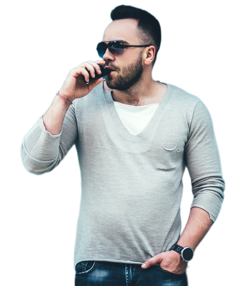 A stylish man with sunglasses and a beard using a portable vaporizer device from a vape shop in Houston