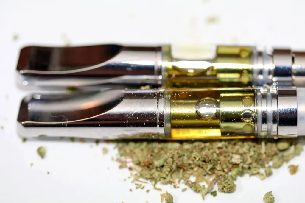 Top tier oil cartridges with cannabis flower, showcasing the best herbal vaporizers Houston has to offer.