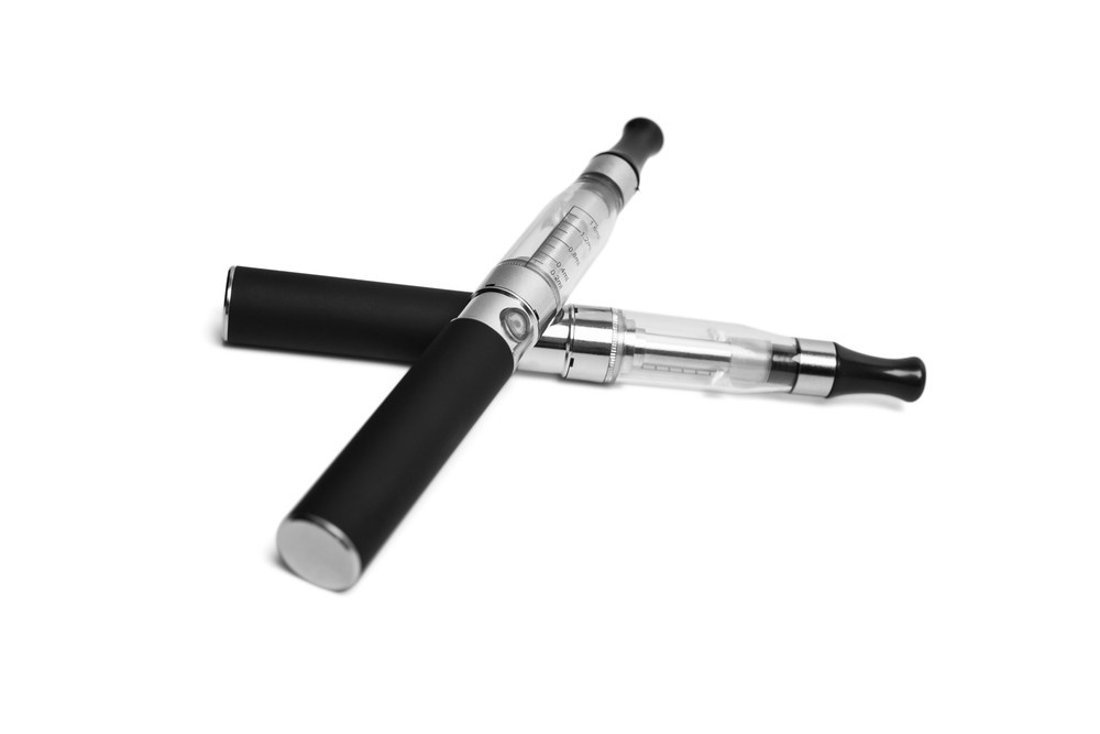 Sleek, refillable e-cigarettes from a top supplier of e-cigarettes houston, crossed on a white background.