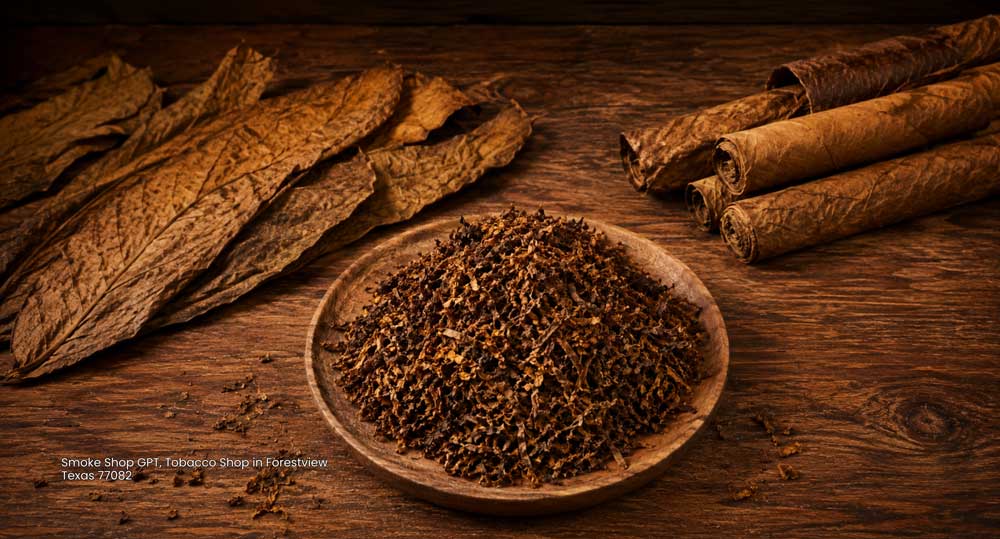 Fine pipe tobacco blend in a wooden bowl alongside rolled leaves, available at a top tobacco shop Houston local.