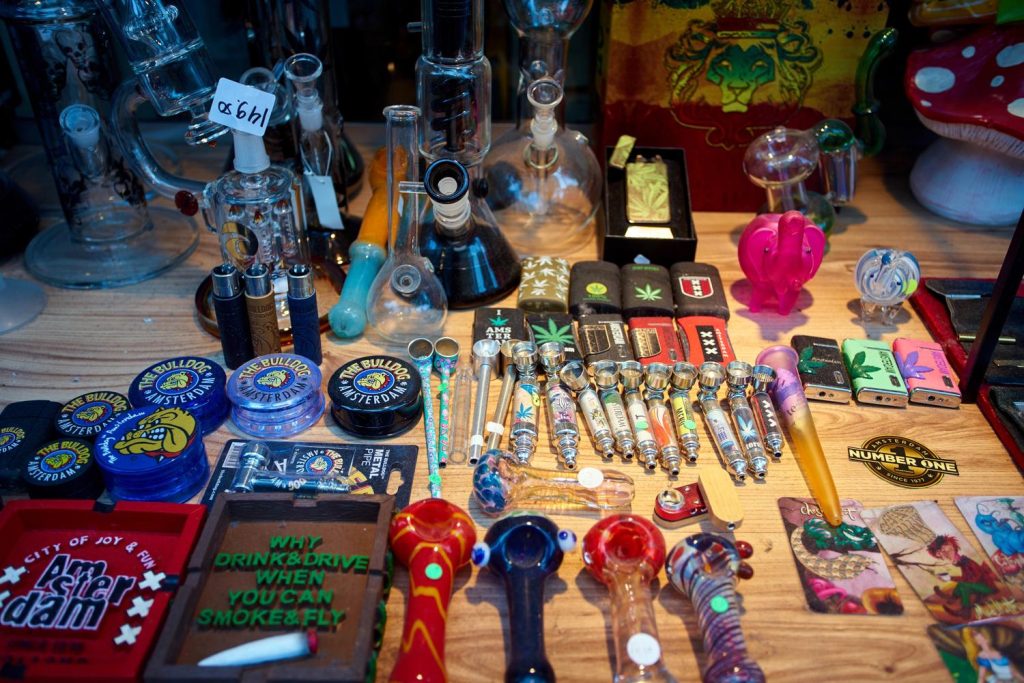 Display of smoking accessories like pipes, bongs, and grinders at a headshop in Houston.
