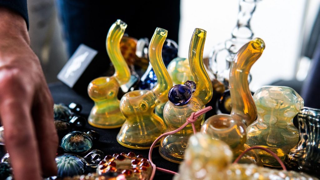 Colorful glass pipes at a head shop Houston, showcasing unique designs for sale, perfect for smoking enthusiasts.